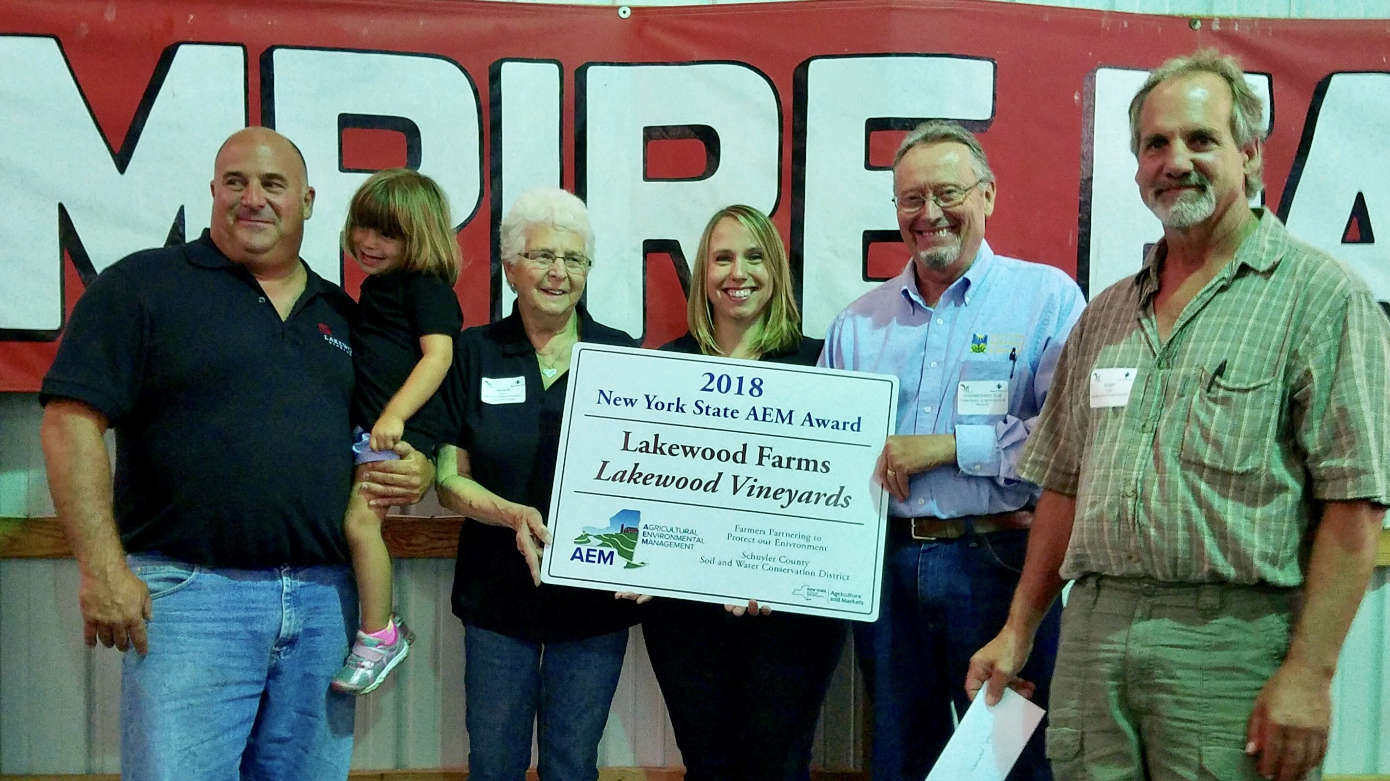 Lakewood crew accepting agriculture award